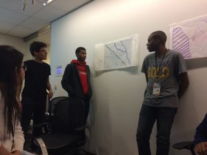 One of the group shows their transit access analysis for one of the site options.